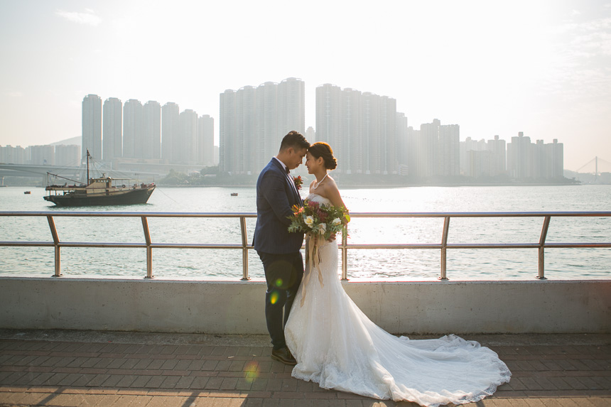 bride and groom posing for a wedding photo at their l'hotel wedding