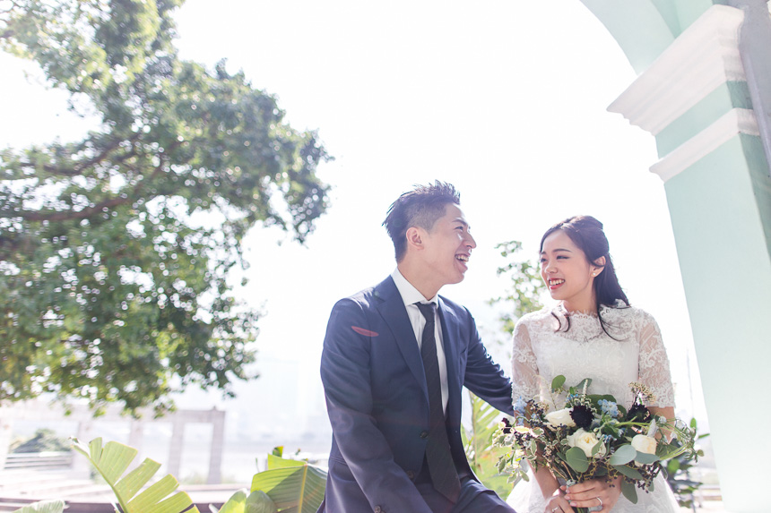 bride and groom laughing during their macau wedding