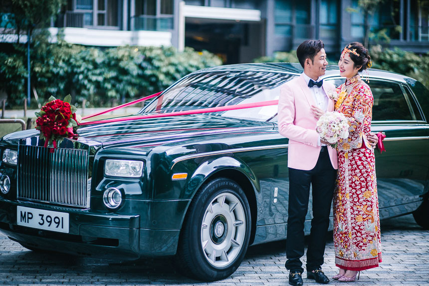 couple having their wedding photos taken at the peninsula hotel in hong kong